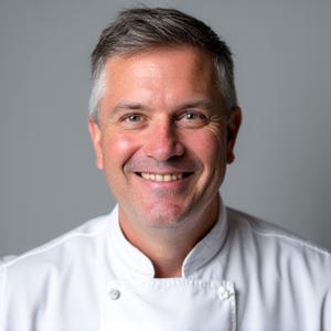 Professional headshot of Chef Julian Thorne, a man with a focused and warm expression